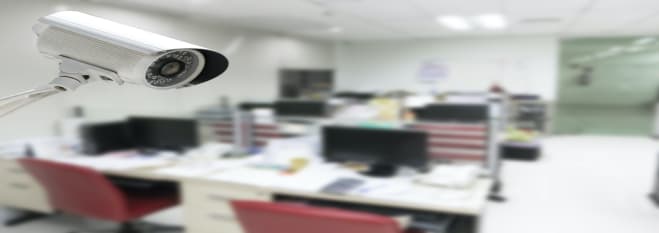 CCTV security camera operating in office building