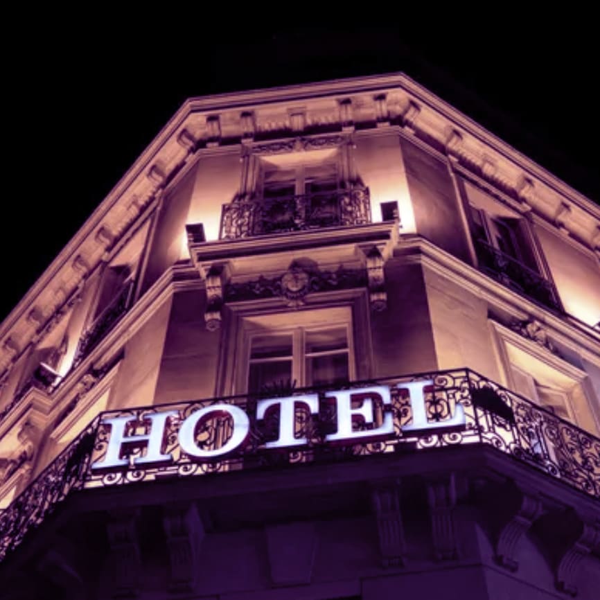 Illuminated hotel sign taken at night