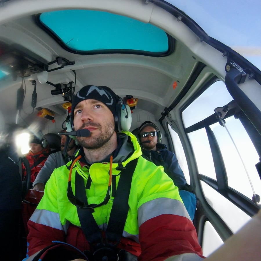 Arnar Ingi in a helicopter during Greenland ice-sheet recovery work
