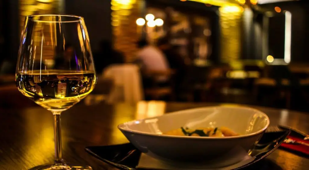 A photo of a table with wine glasses
