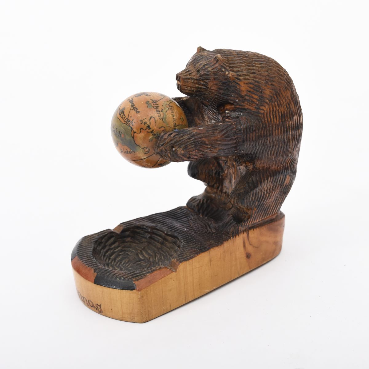 Anonymous bear squlpture with globe
