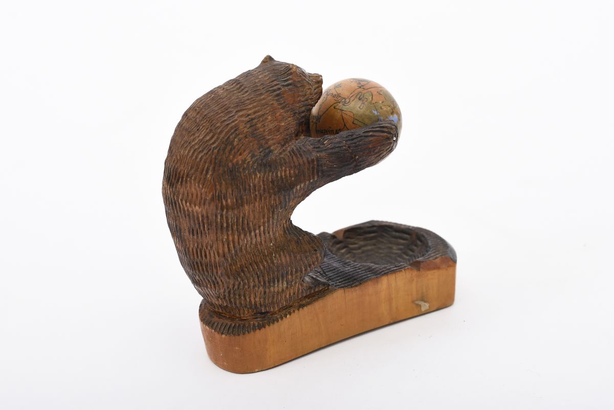 Anonymous bear squlpture with globe back