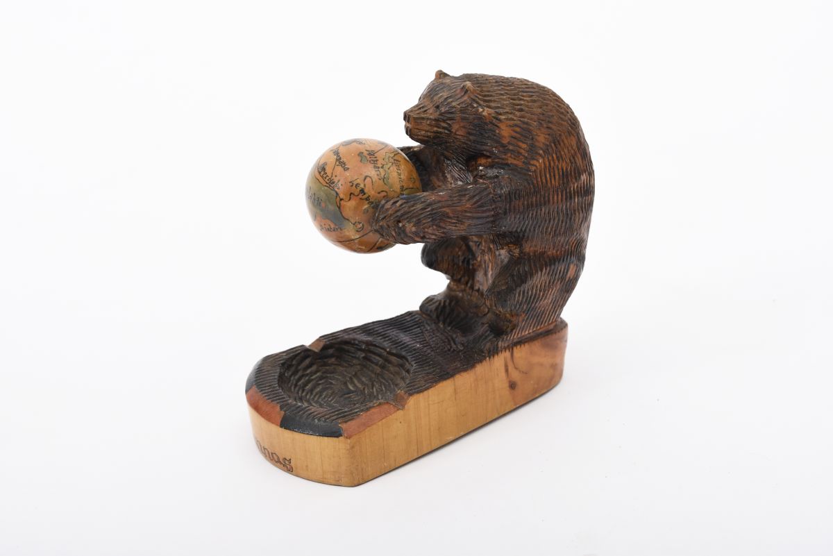 Anonymous bear squlpture with globe
