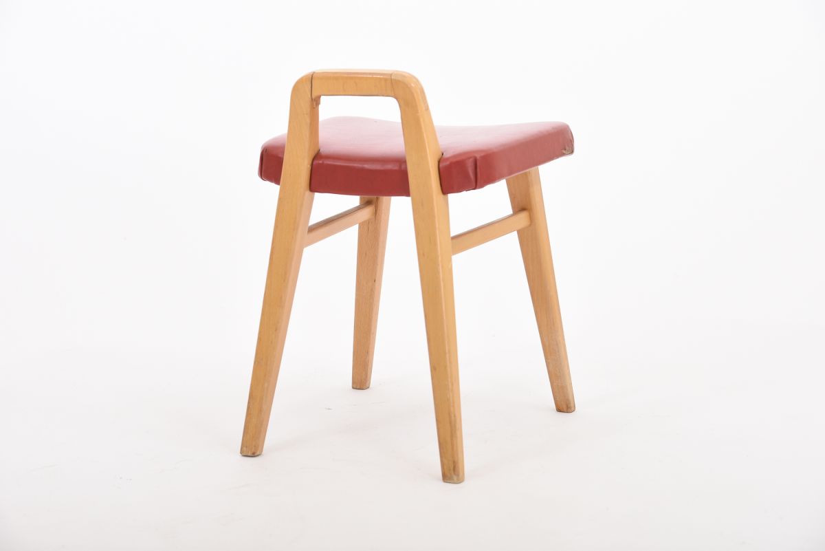 Anonymous red vinyl stool back