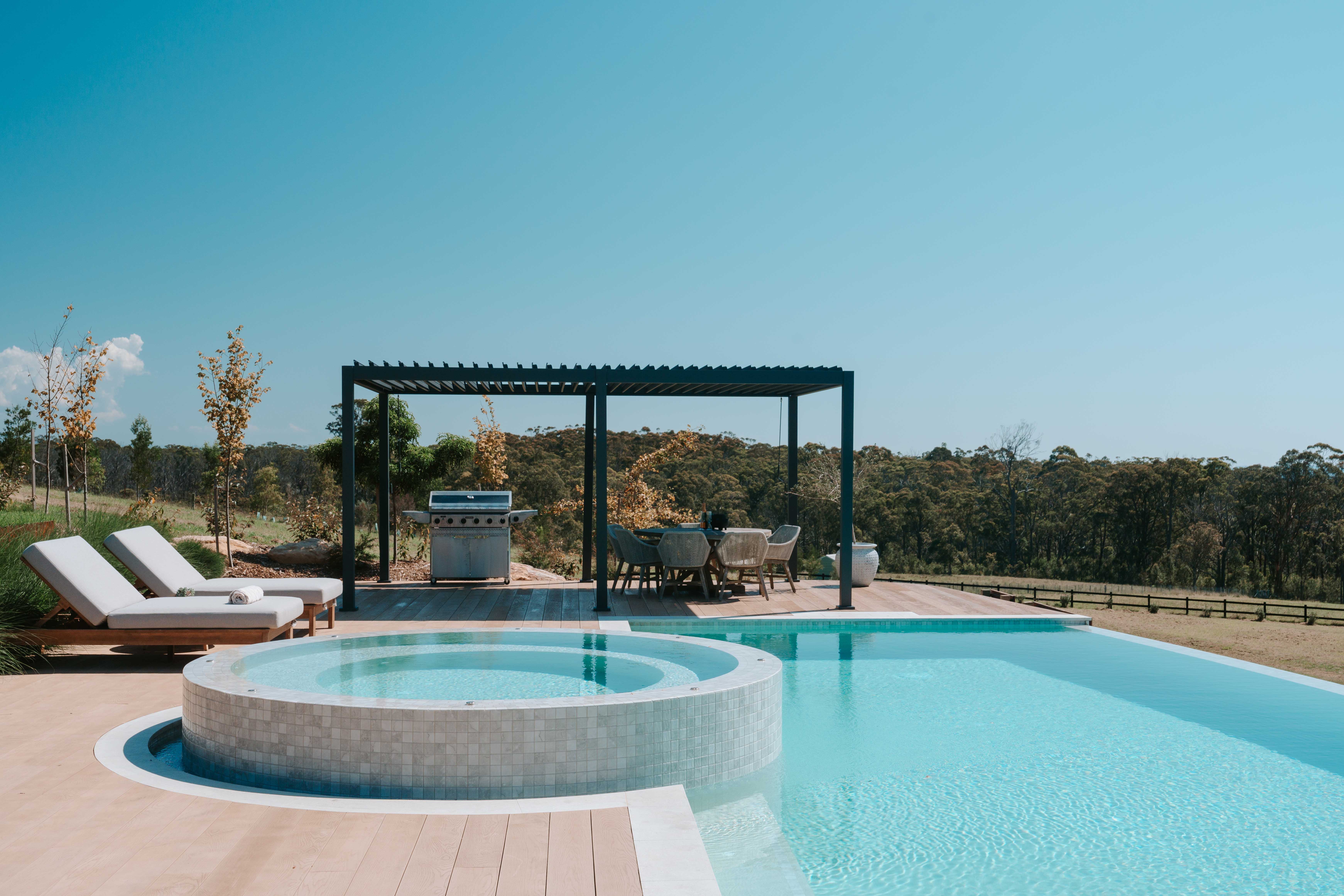 artisanexterior image upload c_limit,f_auto v1775795358 Fragment_Pool_and_Olive_limestone_coping_11_Riviera_Pools_nwinf5