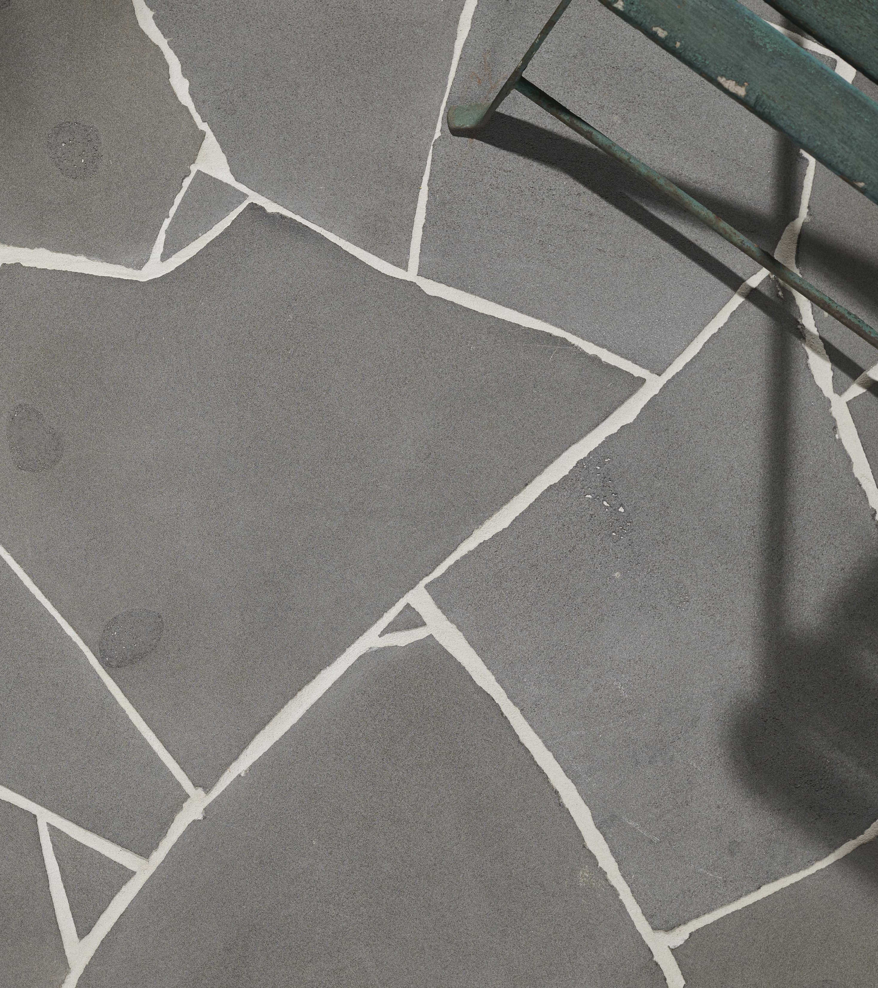 artisanexterior image upload c_limit,f_auto v1777691167 artisan_exterior_bluestone_20mm_crazy_paving_hero_1_mtqoak_6328ea
