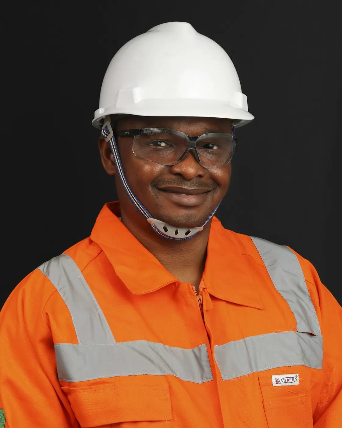An engineer in a hard hat and high-visibility jacket