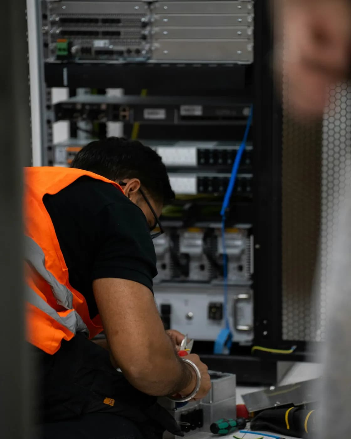 A technician working on server equipment