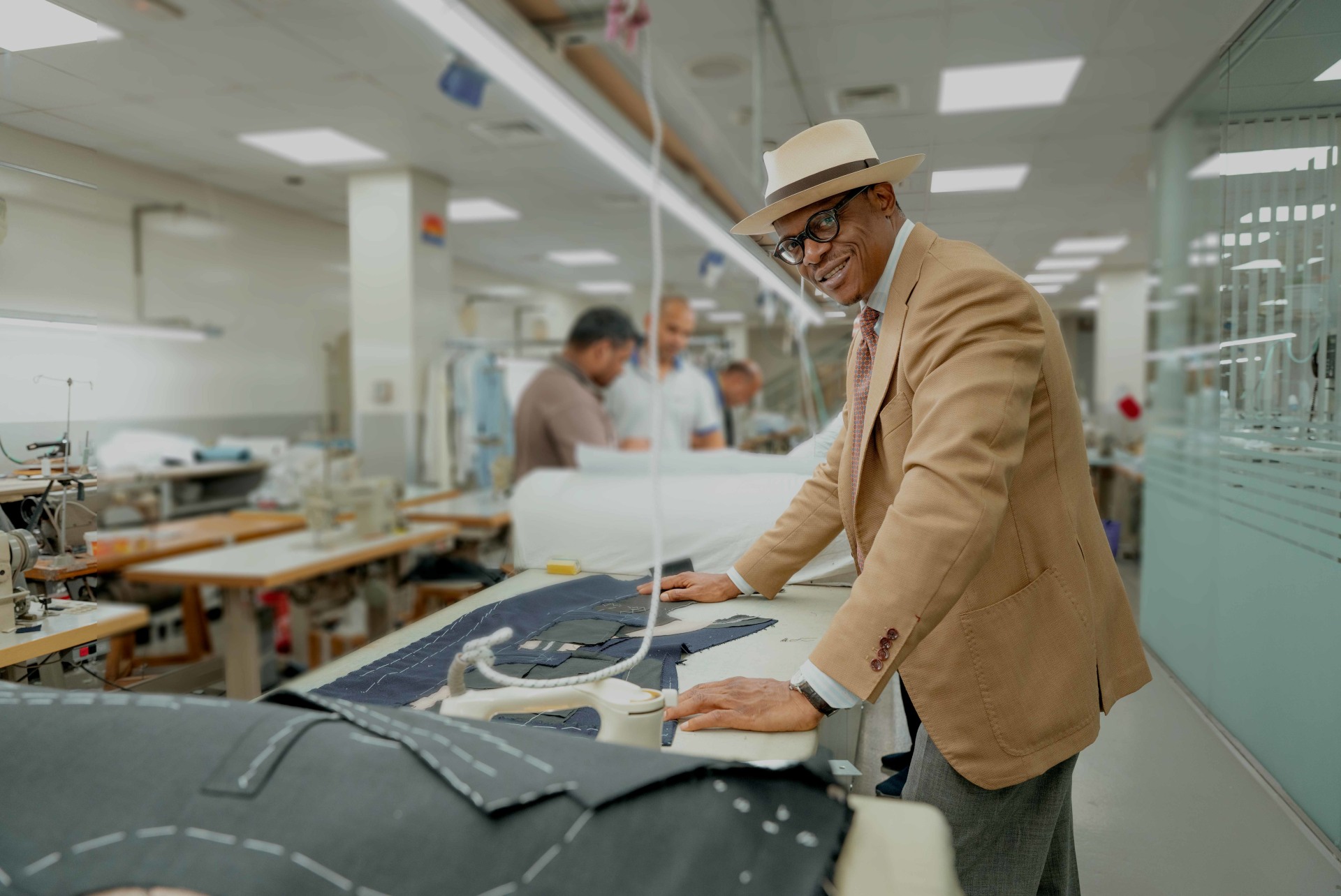 Cloth being laid out on the cutting table