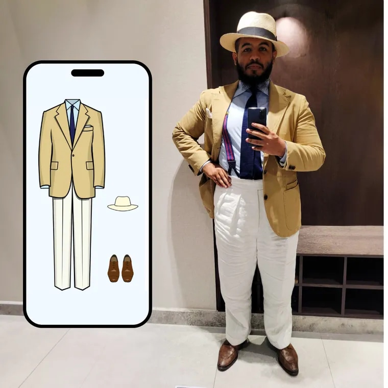 Camel jacket with white trousers, a navy tie and a panama hat, beside the Color Genie screen
