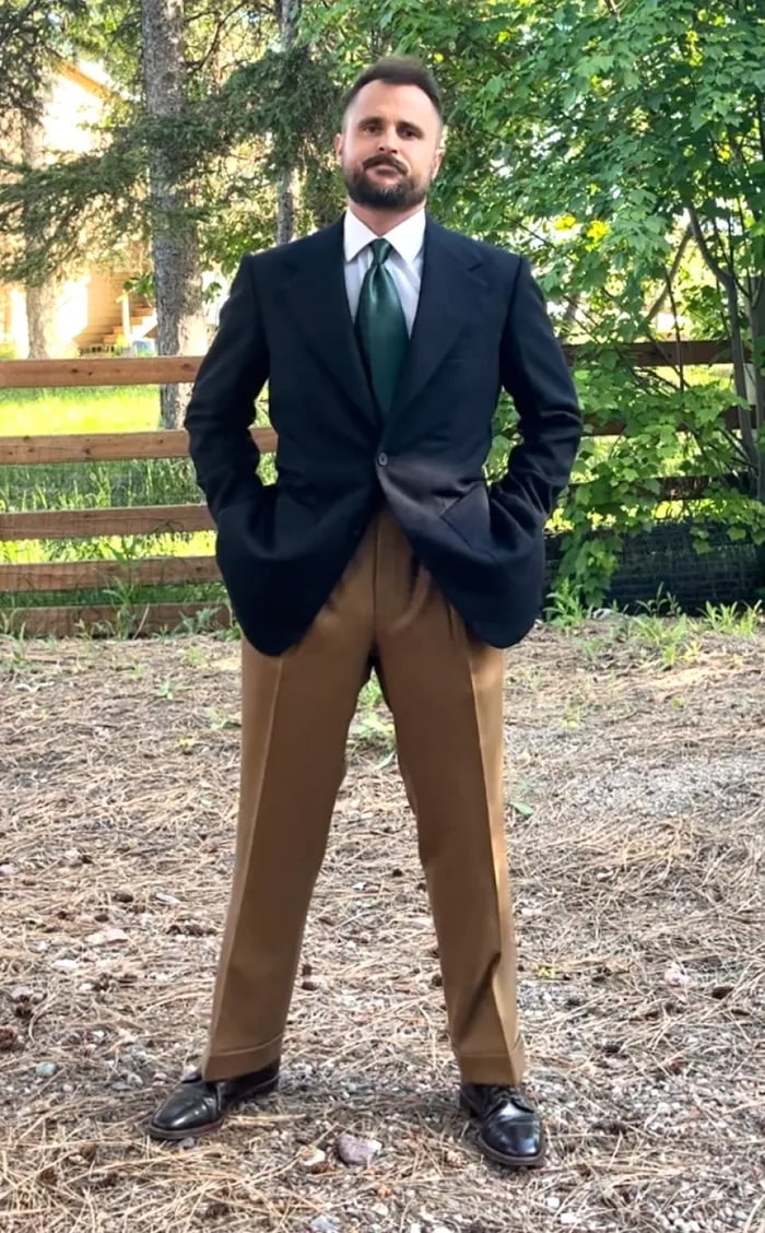 Client adjusting his patterned tie