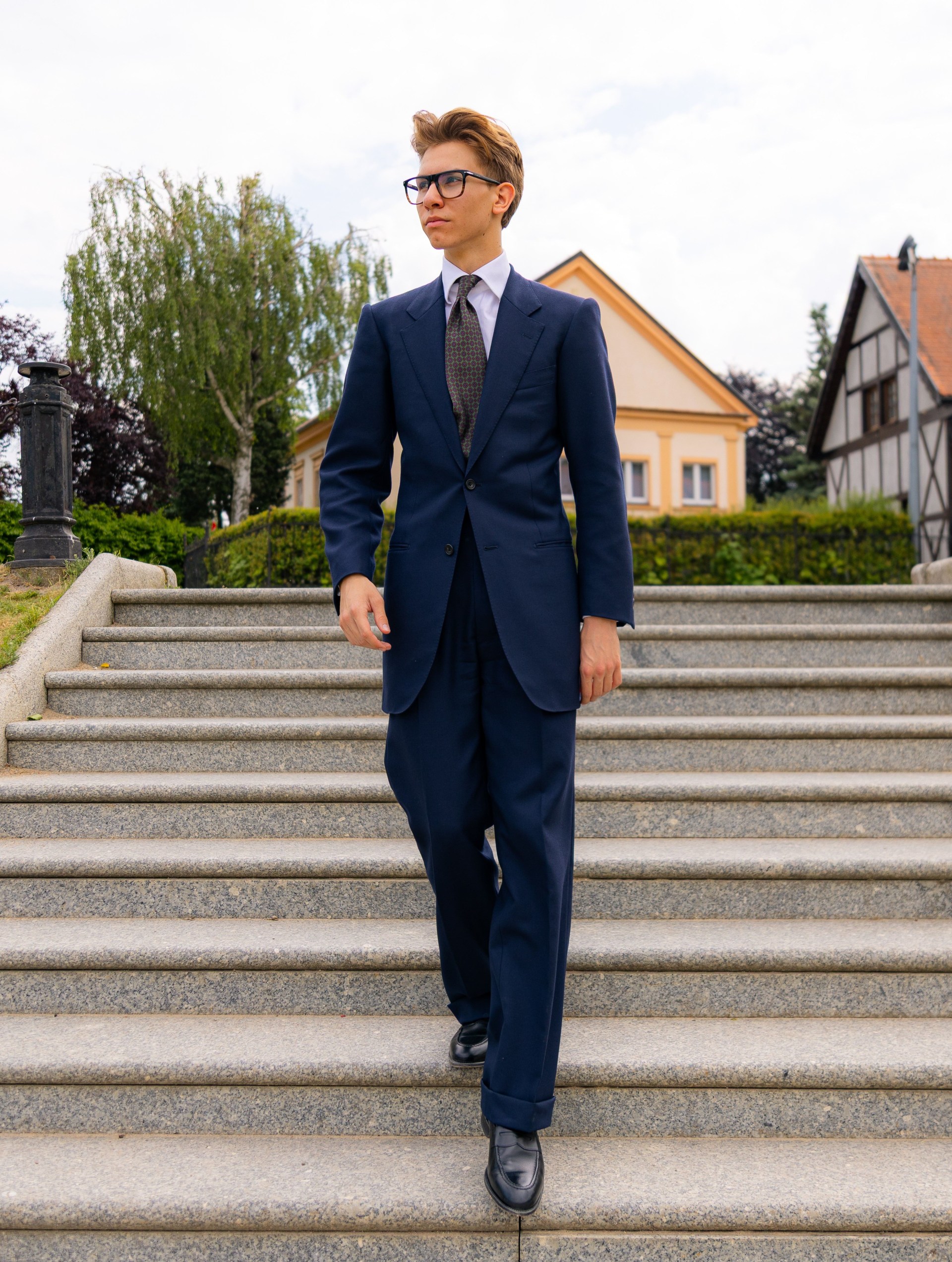AskOkey client wearing a jacket and tie