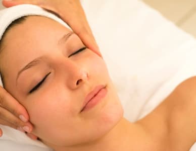 Two Rivers Body Sculpting Masseuse and Client during healing session.