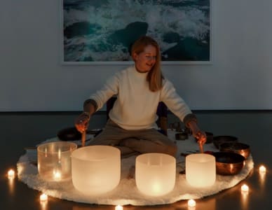 Megan DiSabatino using singing bowls or Himalayan bowls.