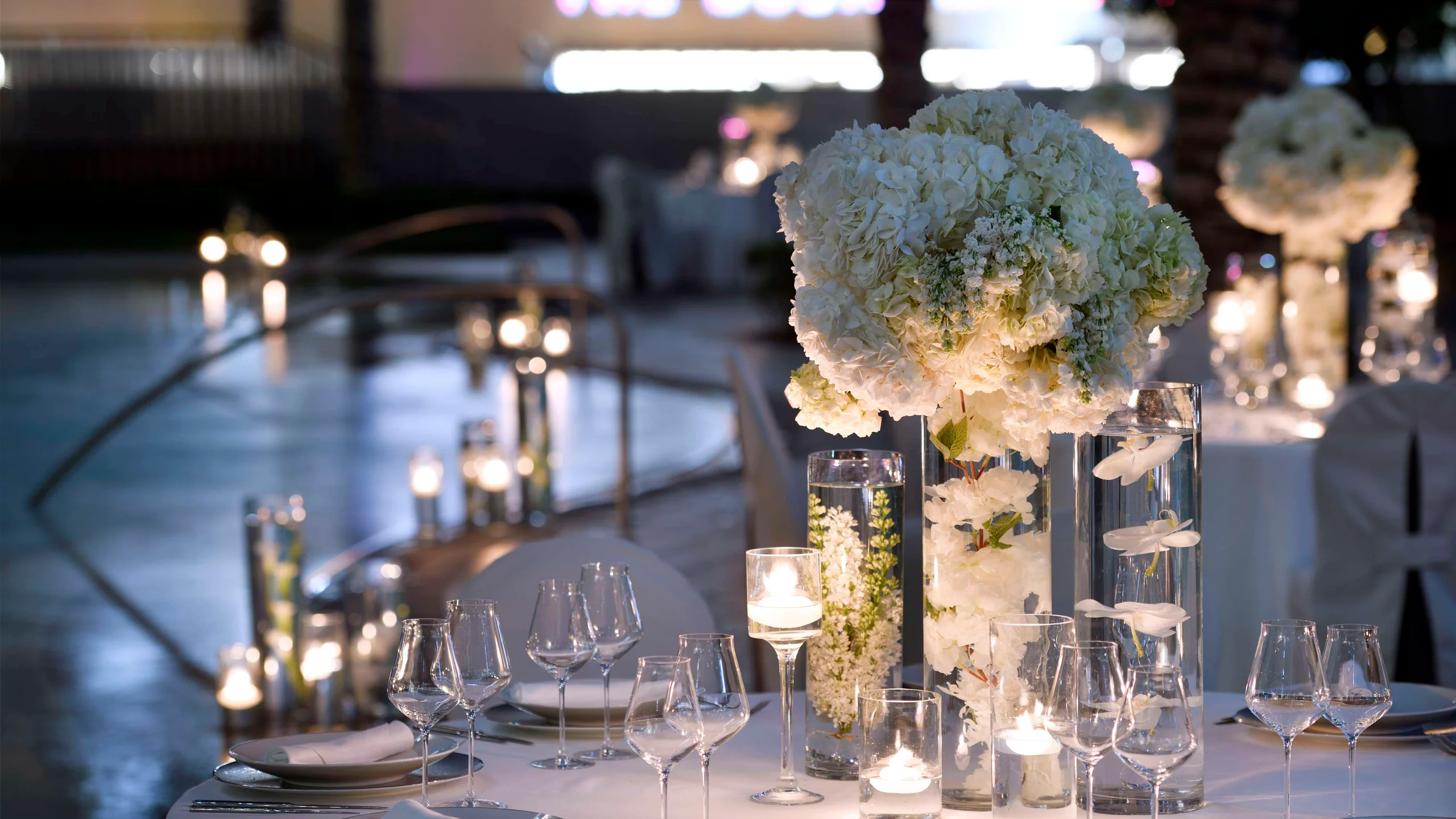 Evening outdoor dining table with candles at the hotel