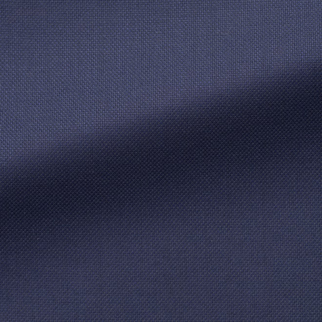 Close-up of a navy blue virgin wool fabric, plain pattern
