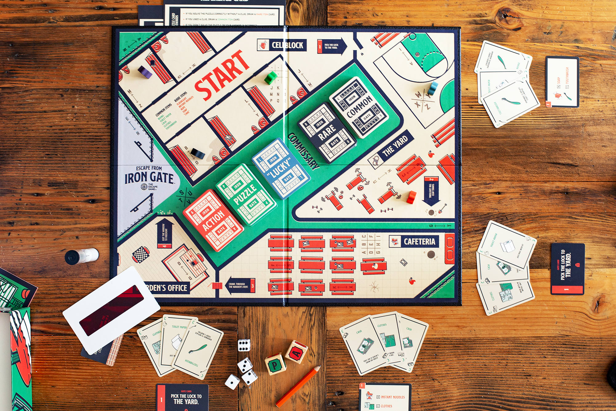 A tabletop view of an escape room board game that you can play at home, by The Escape Game Atlanta.