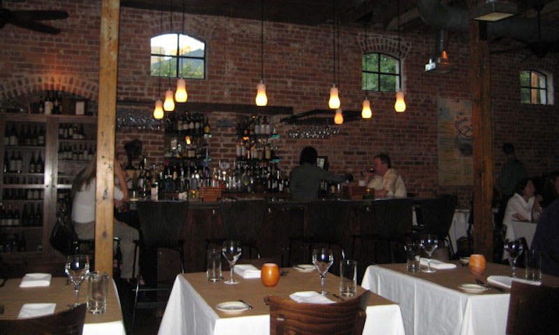 Begin your romantic evening at Wisteria by stopping at the bar.