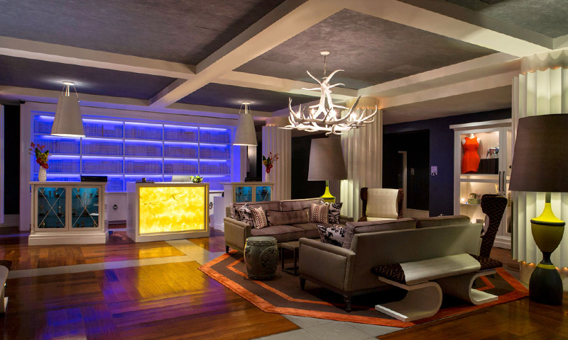 A living room filled with furniture and a fireplace
Description automatically generated