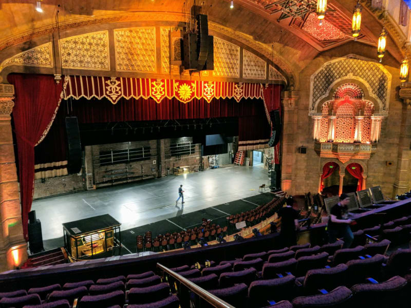A man walks across the stage the Fox Theatre in Atlanta.