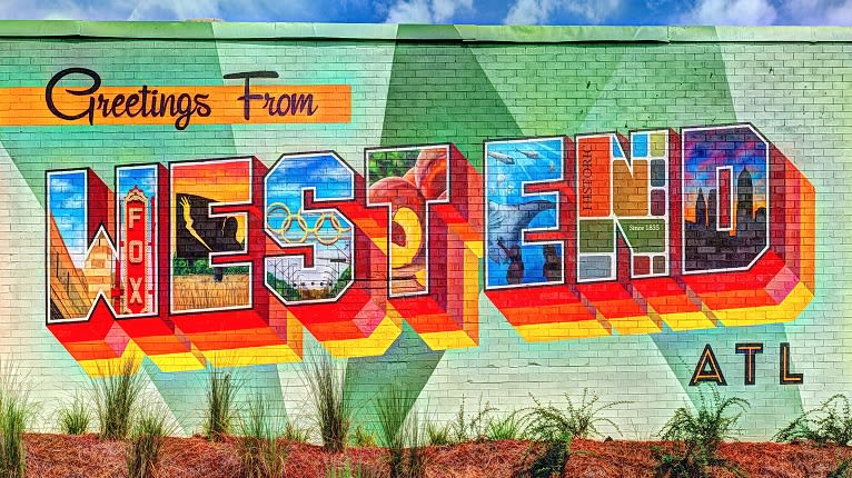 A colorful mural spells out 'West End' with iconic Atlanta symbols in each letter in Atlanta, Georgia.