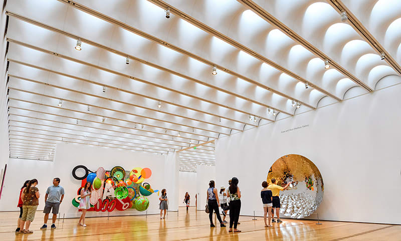 Guests look at an exhibit at the High Museum of Art in Atlanta, Georgia.