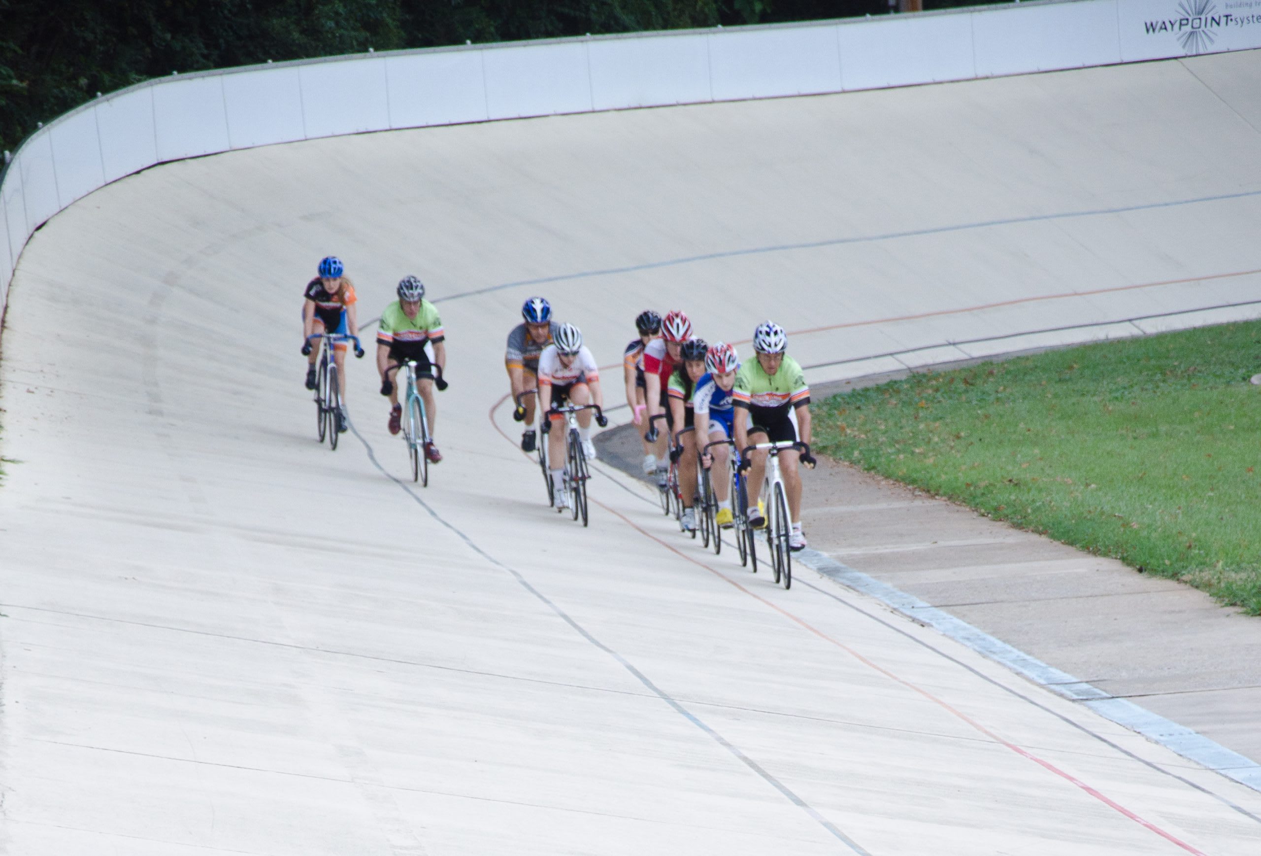 Nearby Day Trips 2 A group of cyclists in colorful jerseys races around a curved track in Atlanta, Georgia.