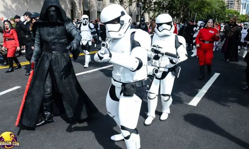 Star Wars fans dressed as Stormtroopers and Darth Vader march in a parade in Atlanta, Georgia.