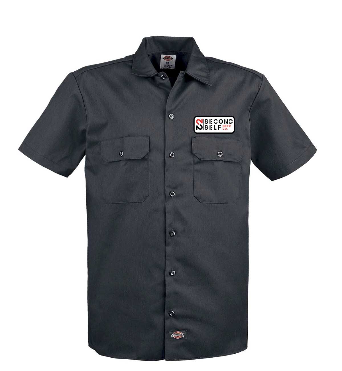 A black short-sleeved work shirt with two chest pockets and a logo patch in Atlanta, Georgia.
