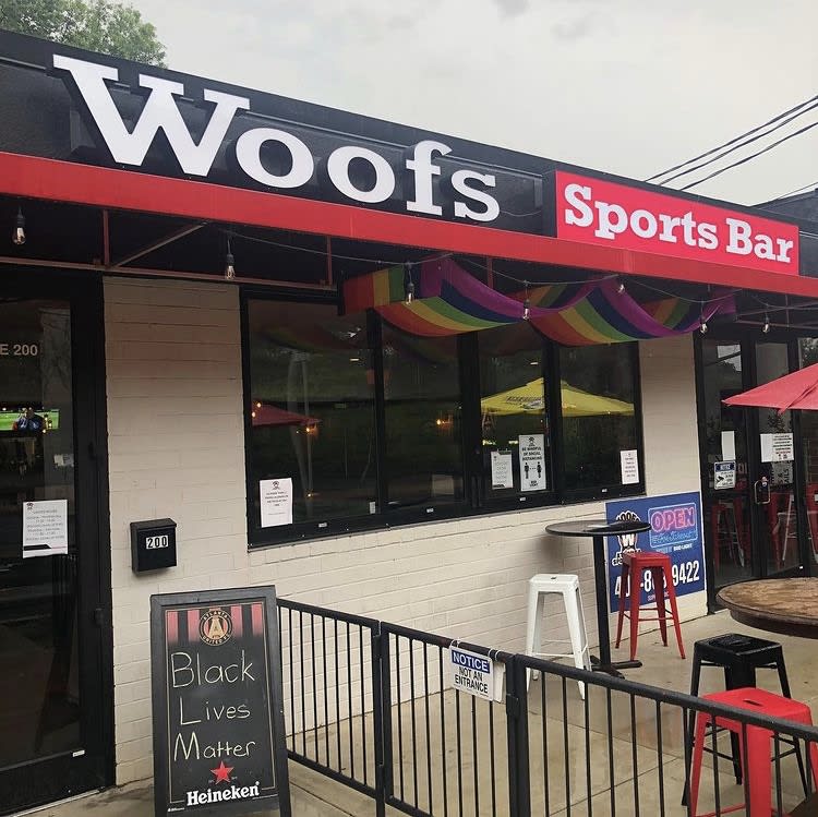 A sports bar with a rainbow awning and a sign supporting Black Lives Matter in Atlanta, Georgia.