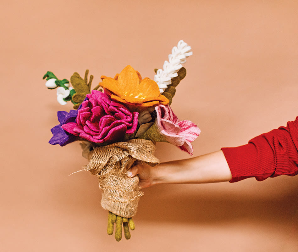 A vibrant bouquet of handmade felt flowers in various colors tied with burlap in Atlanta, Georgia.