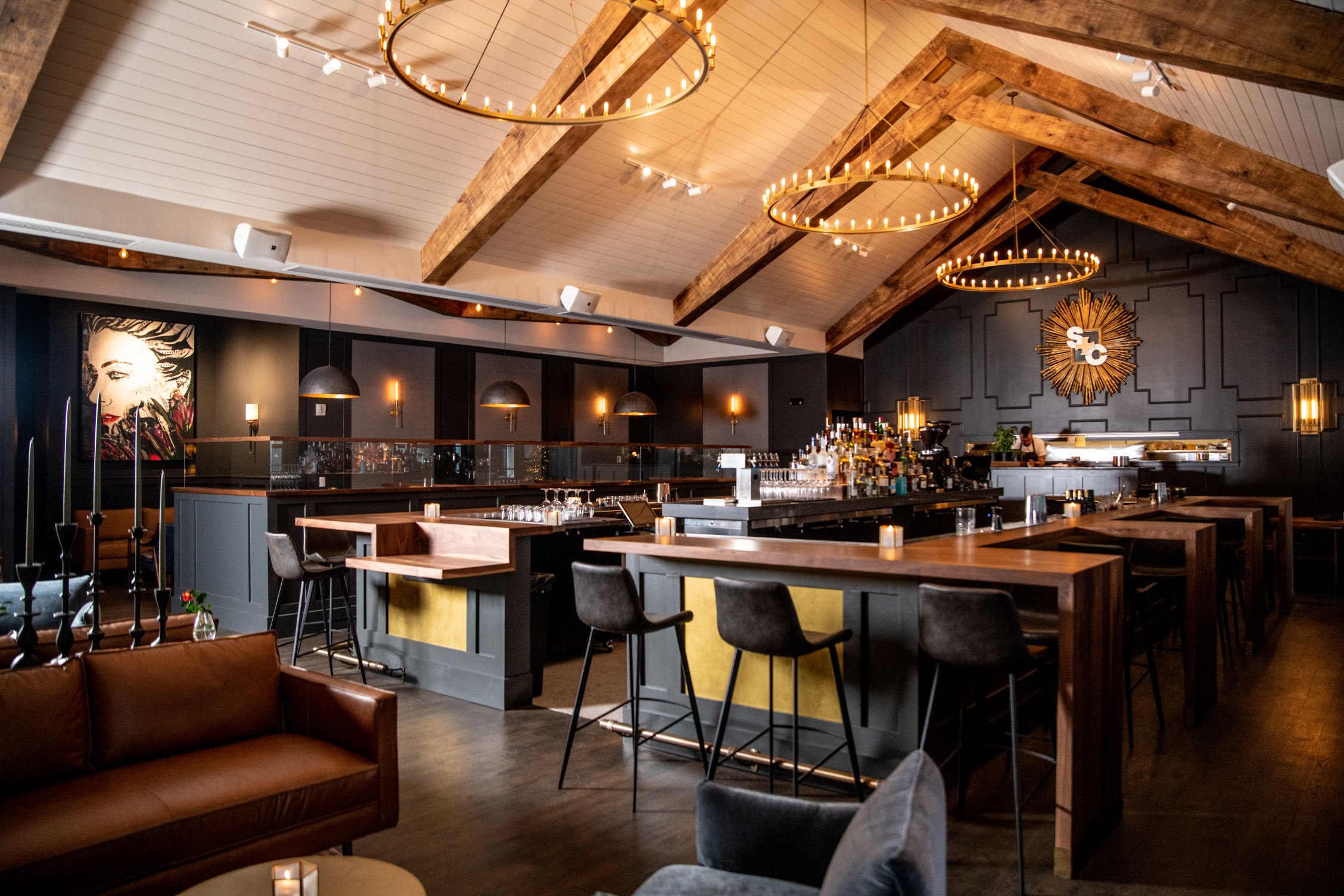 Warm up at the Best Restaurants for Cozy Winter Dining in Atlanta 7 A modern, upscale bar with a rustic wooden ceiling and sophisticated lighting in Atlanta, Georgia.