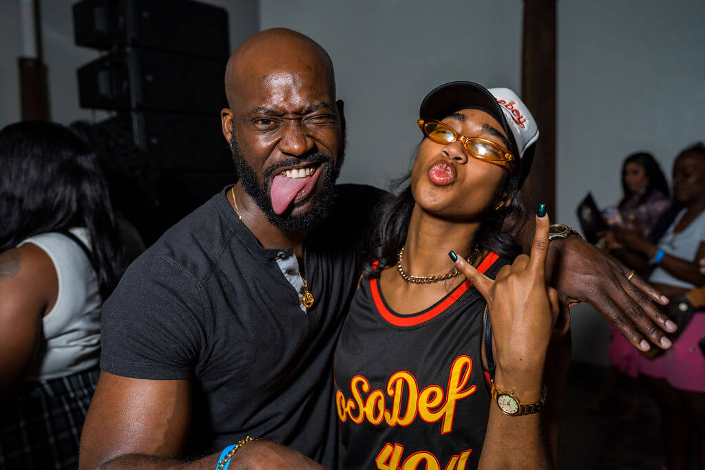 A man and woman pose playfully for the camera, making silly faces and gestures in Atlanta, Georgia.