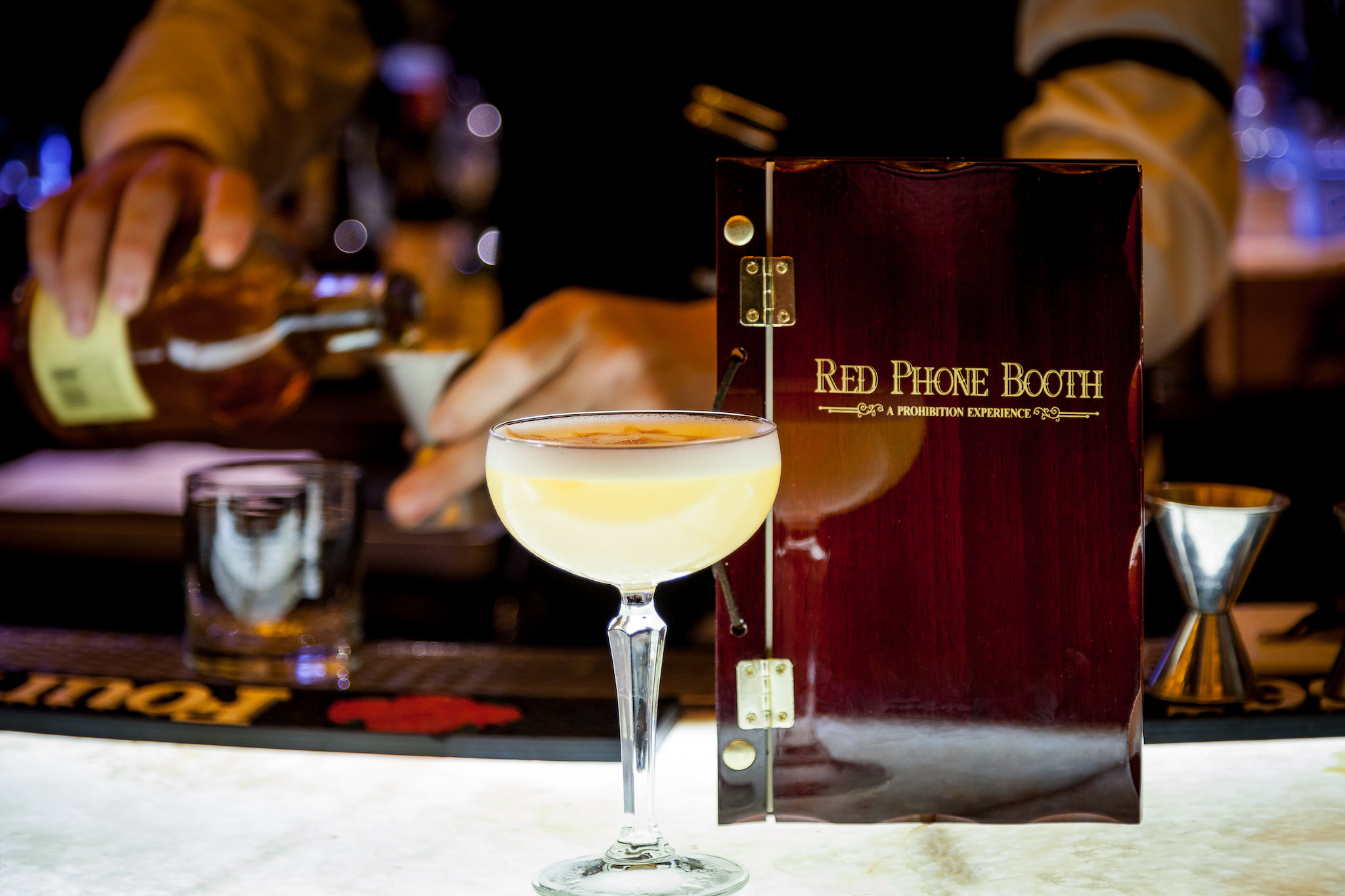 Enjoy a cigar with a classic craft cocktail at Red Phone Booth