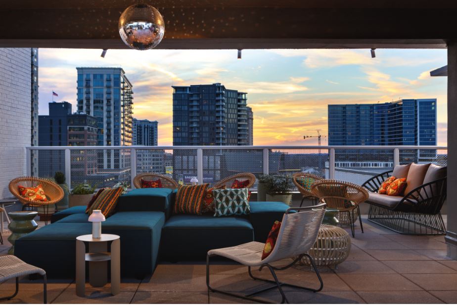 Lounge chairs in front of an Atlanta skyline.