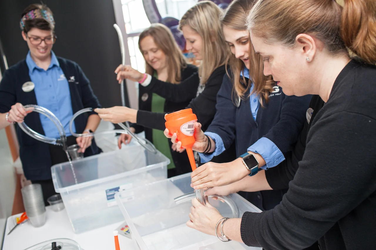 image of teens getting hands-on training in environmental conservation in the aquarium's leadership program.