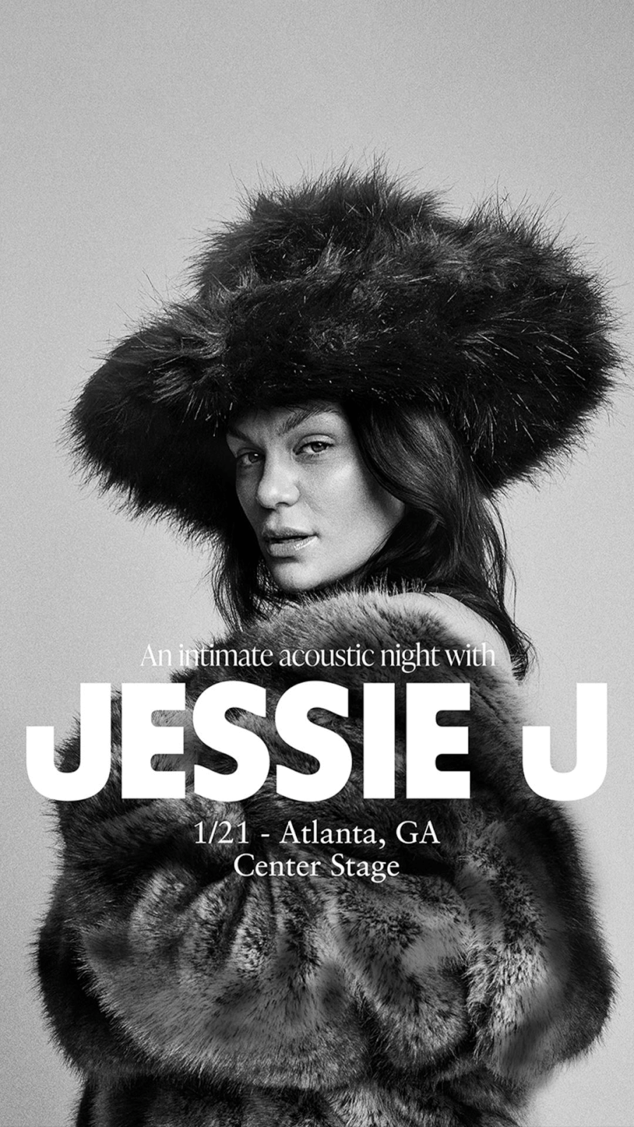 A woman in a fur coat and hat poses for a black and white concert advertisement in Atlanta, Georgia.