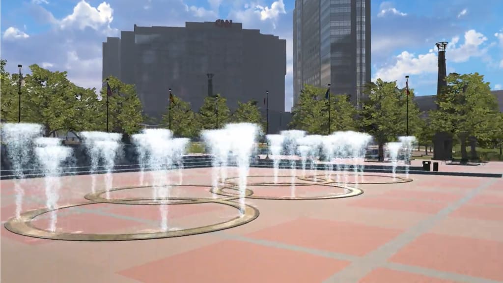A city plaza features an Olympic-ring-inspired water fountain with skyscrapers in the background in Atlanta, Georgia.