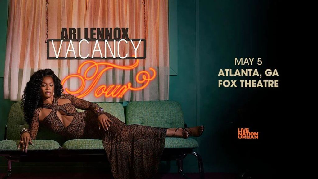 Ari Lennox reclines on a green couch in a stylish leopard print dress, promoting her 'Vacancy Tour' at the Fox Theatre in Atlanta, GA on May 5th in Atlanta, Georgia.