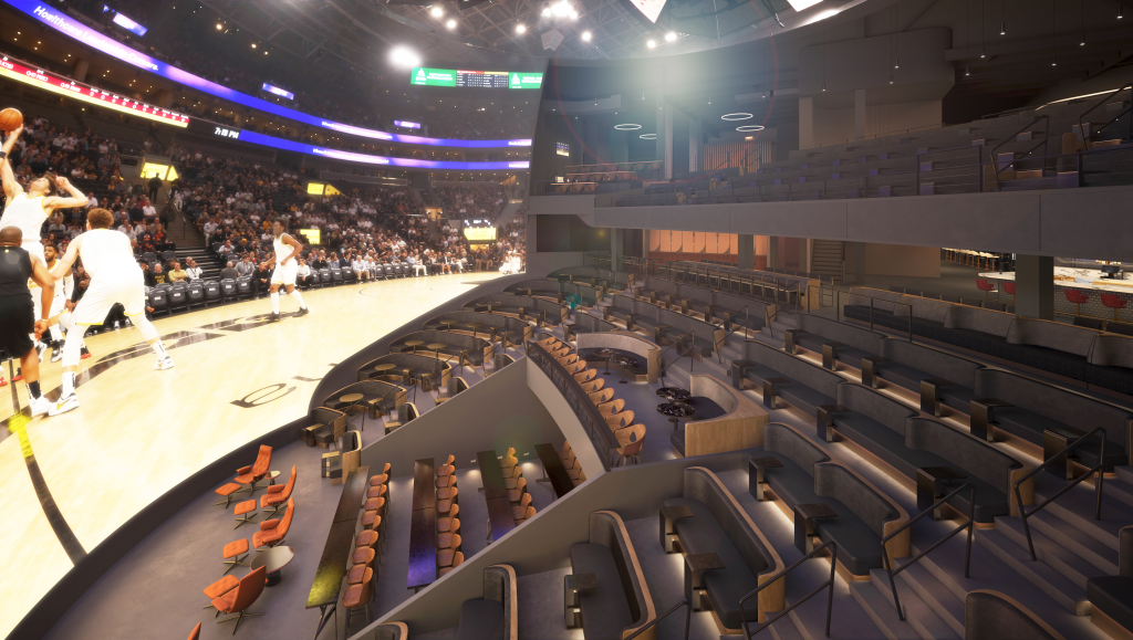 A basketball game in progress at a modern indoor arena with tiered seating and a large crowd in Atlanta, Georgia.