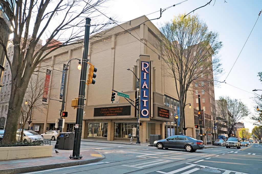 Best Places for Live Music in Atlanta 12 A city street scene with a prominent theater marquee and traffic lights in Atlanta, Georgia.