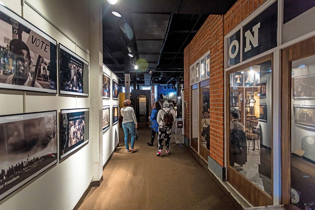 People looking at the exhibits at Apex Museum in Atlanta.