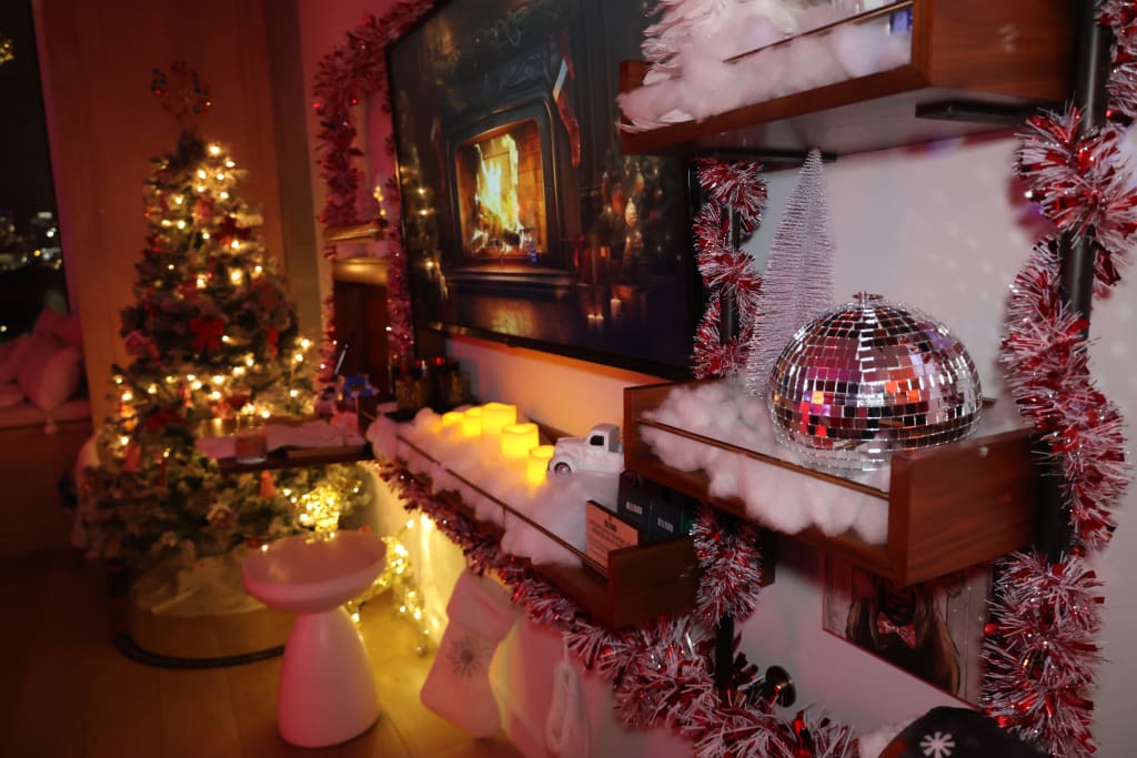 A festive living room with a decorated Christmas tree, fireplace, and holiday decorations in Atlanta, Georgia.