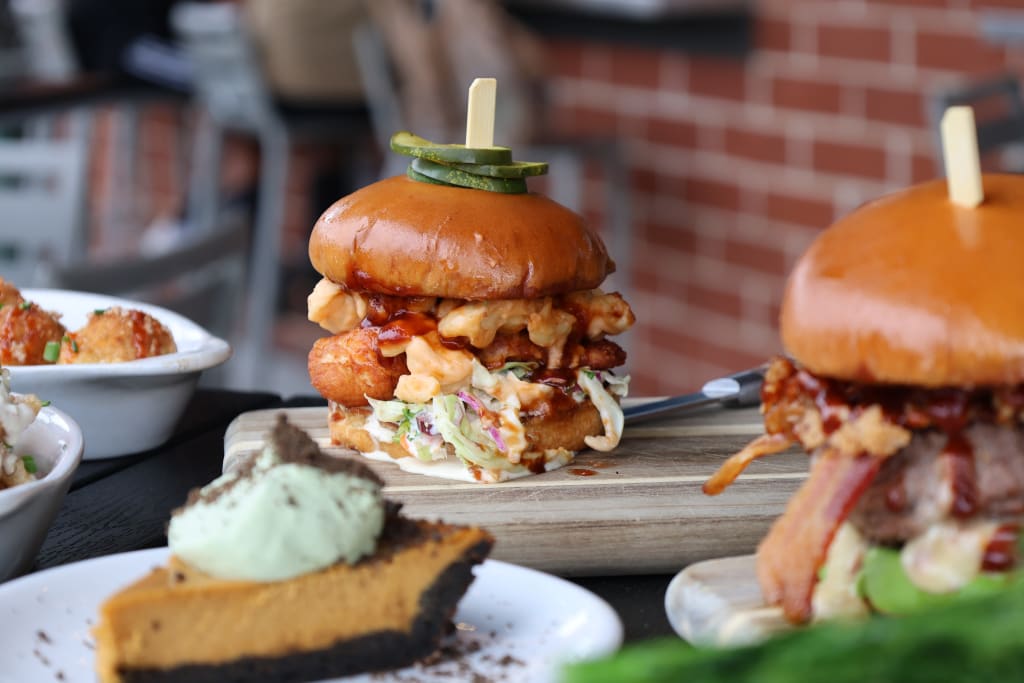 Explore Atlanta Beltline Southwest Trail 7 A mouthwatering display of gourmet burgers, fried chicken, and pumpkin pie dessert in Atlanta, Georgia.