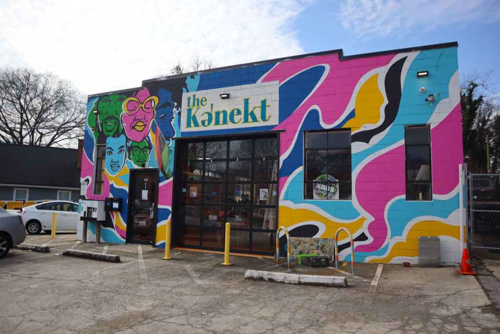 Explore Atlanta Beltline Southwest Trail 3 A vibrant mural adorns the exterior of a building with the name 'The Konekt' prominently displayed in Atlanta, Georgia.