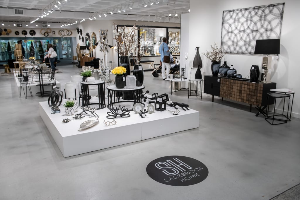 Modern home decor store with sleek black and white furniture, vases, and wall art in Atlanta, Georgia.