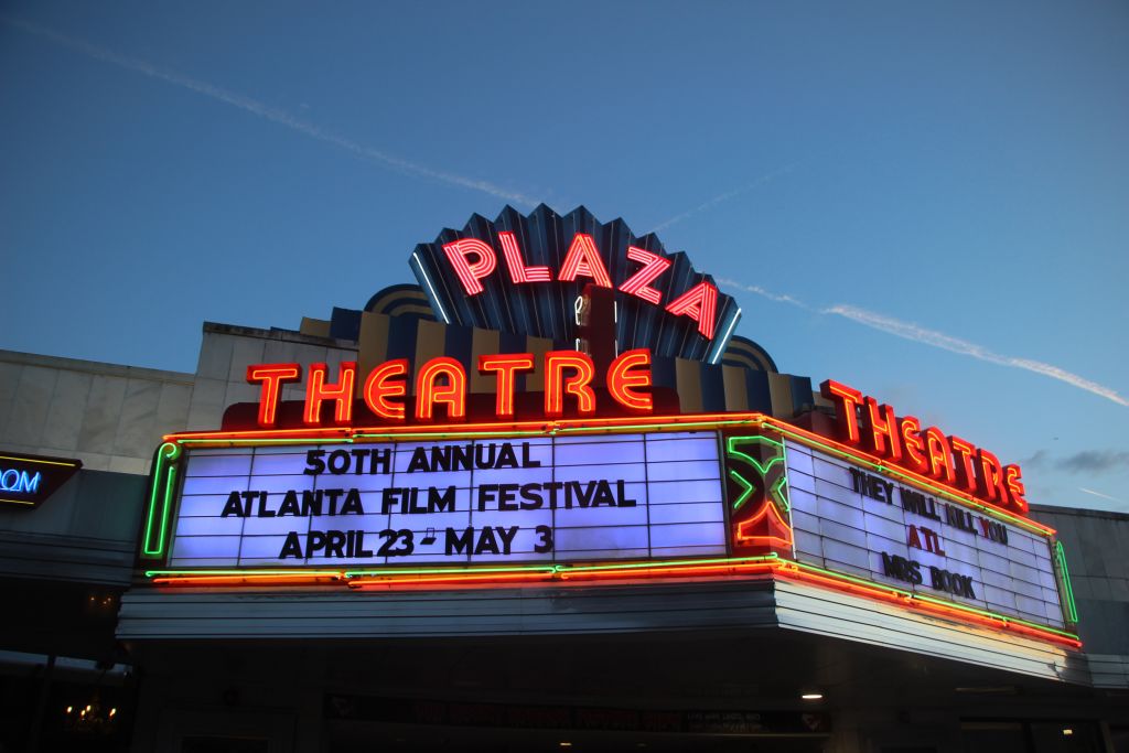 The Plaza Theatre's neon sign advertises the 50th Annual Atlanta Film Festival, running from April 23rd to May 3rd in Atlanta, Georgia.