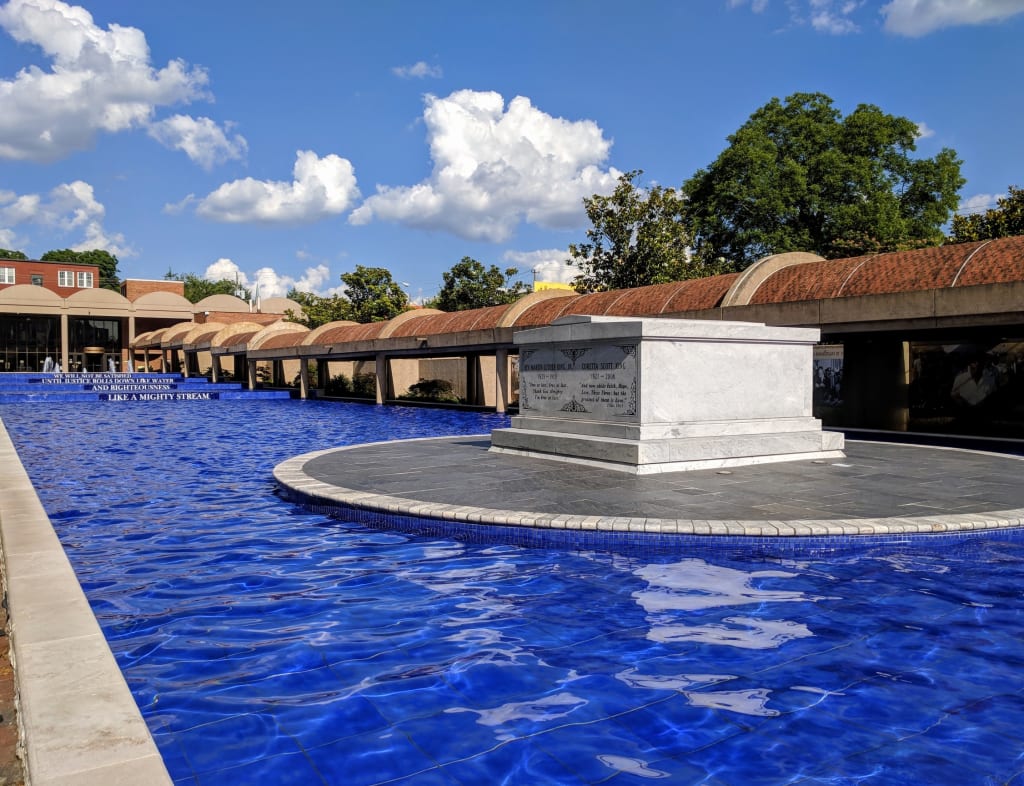 Outdoor Family Fun in Atlanta and Beyond 5 a large pool with a stone monument in it