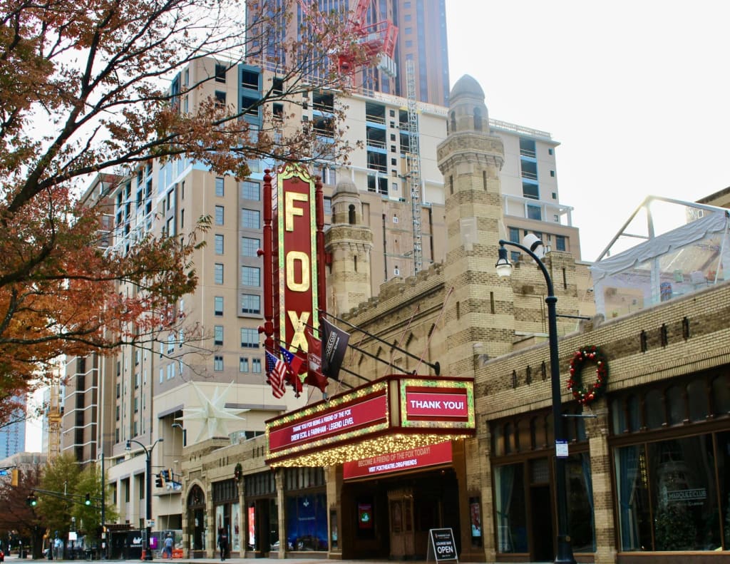 The Fox Theatre marquee in Atlanta, Georgia, is festively lit with holiday lights and a 'Thank You!' message in Atlanta, Georgia.
