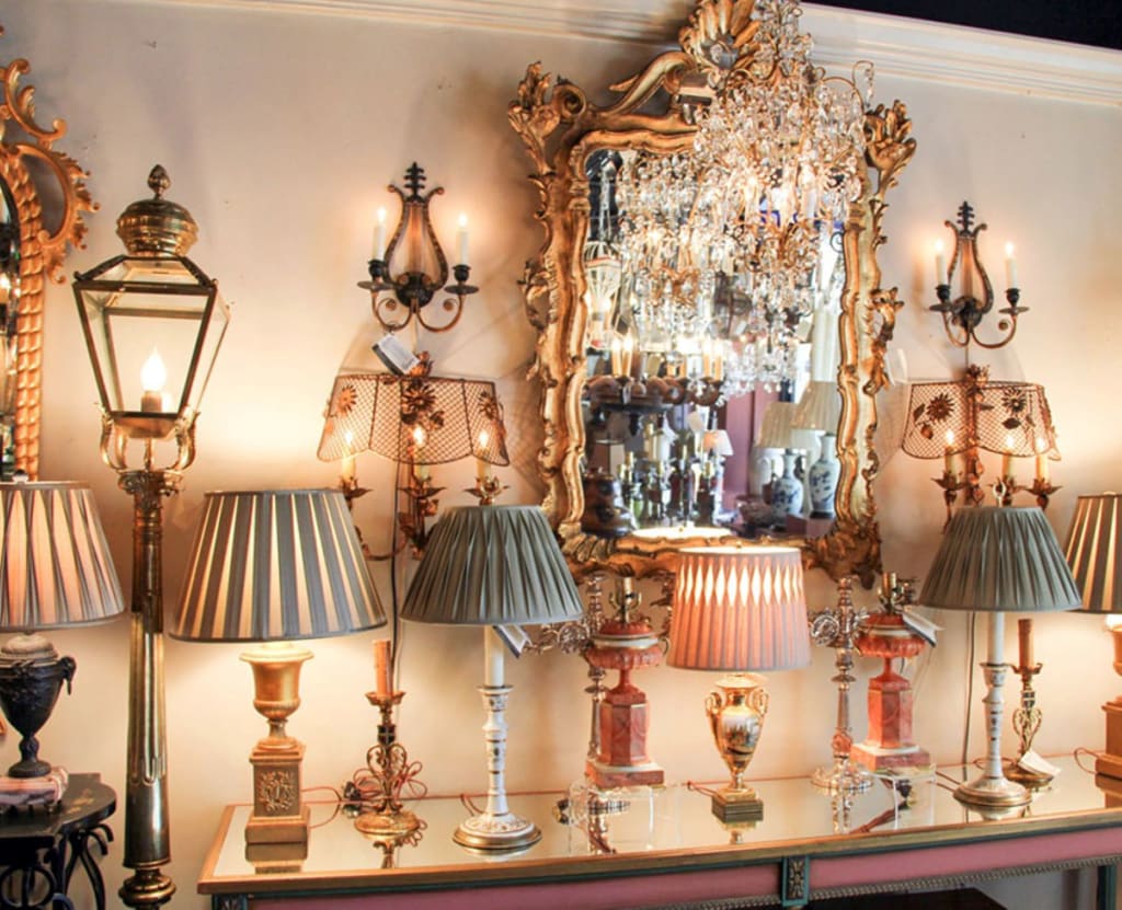 An ornate room filled with antique lamps, chandeliers, and mirrors in Atlanta, Georgia.